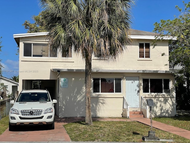 view of front of property featuring entry steps and stucco siding
