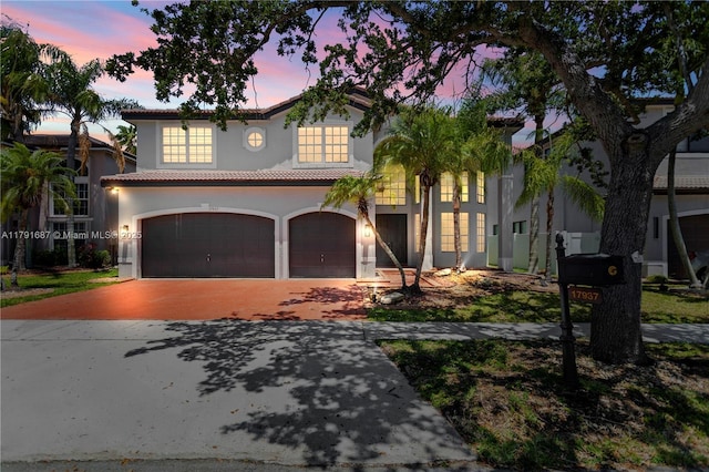17937 SW 36th St, Miramar, FL 33029 - mediterranean / spanish house with stucco siding, driveway, a tile roof, and a garage
