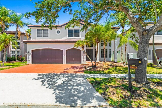 17937 SW 36th St, Miramar, FL 33029 - mediterranean / spanish-style house featuring a tiled roof, a garage, concrete driveway, and stucco siding