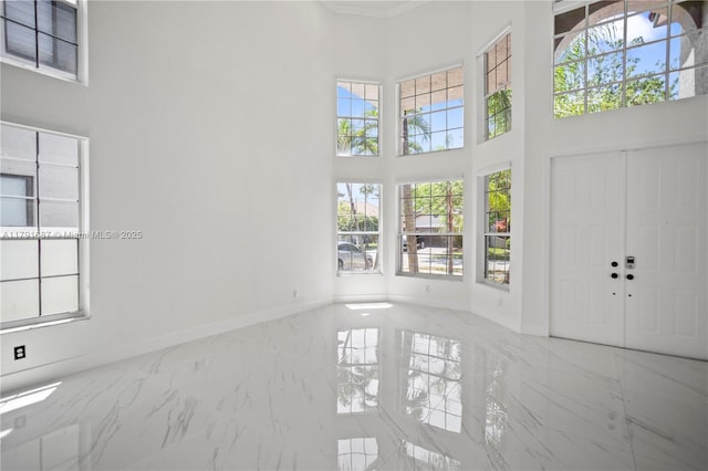 17937 SW 36th St, Miramar, FL 33029 - interior space with baseboards, marble finish floor, and a towering ceiling