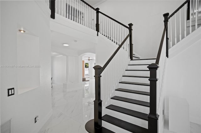 17937 SW 36th St, Miramar, FL 33029 - stairs with ceiling fan, arched walkways, baseboards, marble finish floor, and a high ceiling