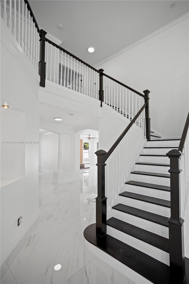 17937 SW 36th St, Miramar, FL 33029 - stairway with arched walkways, baseboards, marble finish floor, and a high ceiling