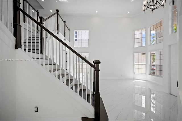 17937 SW 36th St, Miramar, FL 33029 - stairs with an inviting chandelier, ornamental molding, marble finish floor, a towering ceiling, and baseboards