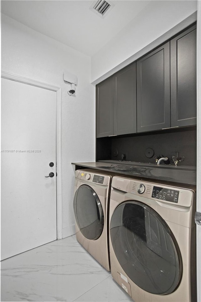 17937 SW 36th St, Miramar, FL 33029 - washroom with cabinet space, independent washer and dryer, visible vents, and marble finish floor
