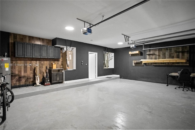 17937 SW 36th St, Miramar, FL 33029 - garage with wooden walls, water heater, and a garage door opener