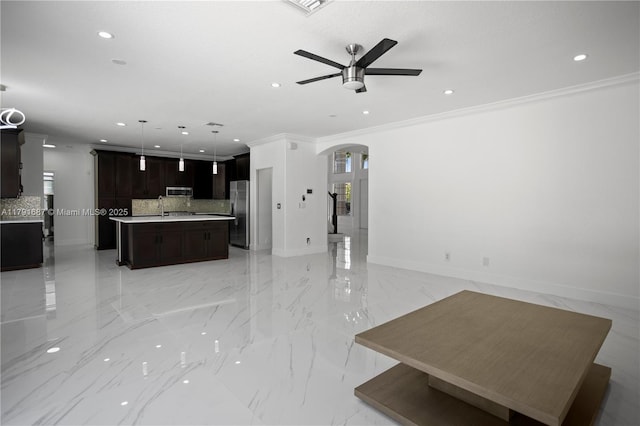 17937 SW 36th St, Miramar, FL 33029 - unfurnished living room featuring arched walkways, a sink, ceiling fan, and marble finish floor