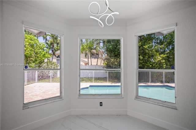 17937 SW 36th St, Miramar, FL 33029 - unfurnished dining area featuring an inviting chandelier, baseboards, crown molding, and marble finish floor