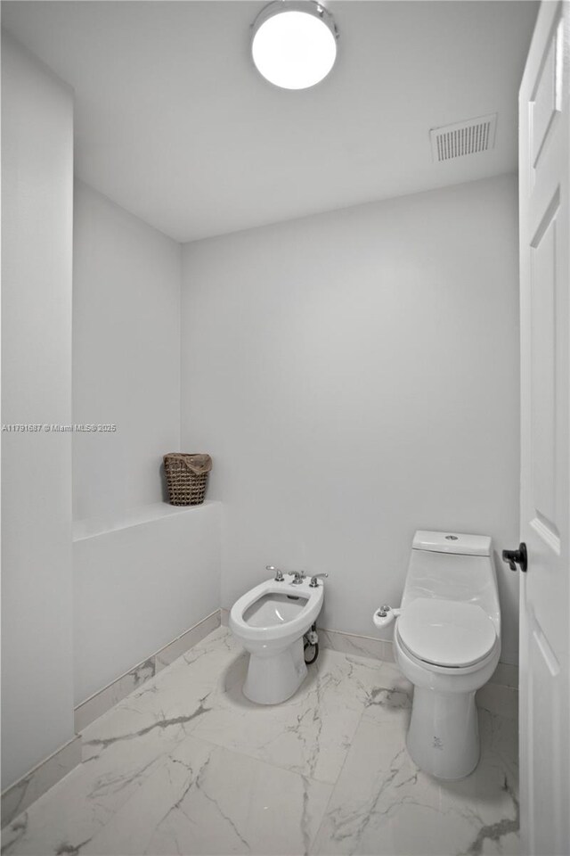 17937 SW 36th St, Miramar, FL 33029 - bathroom featuring toilet, visible vents, a bidet, and marble finish floor