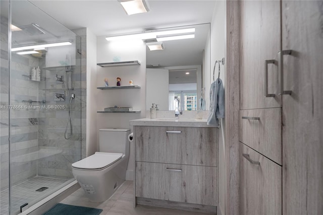bathroom with marble finish floor, vanity, toilet, and a stall shower