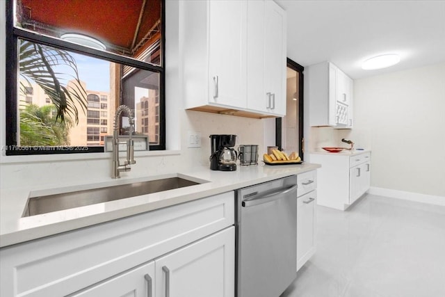 7153 Promenade Dr Unit 302, Boca Raton, FL 33433 - kitchen featuring dishwasher, a sink, white cabinetry, light countertops, and light tile patterned flooring