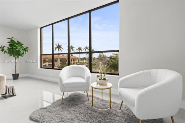7153 Promenade Dr Unit 302, Boca Raton, FL 33433 - living area featuring baseboards