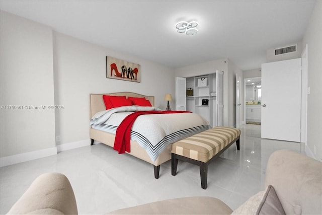 7153 Promenade Dr Unit 302, Boca Raton, FL 33433 - bedroom with ensuite bathroom and baseboards