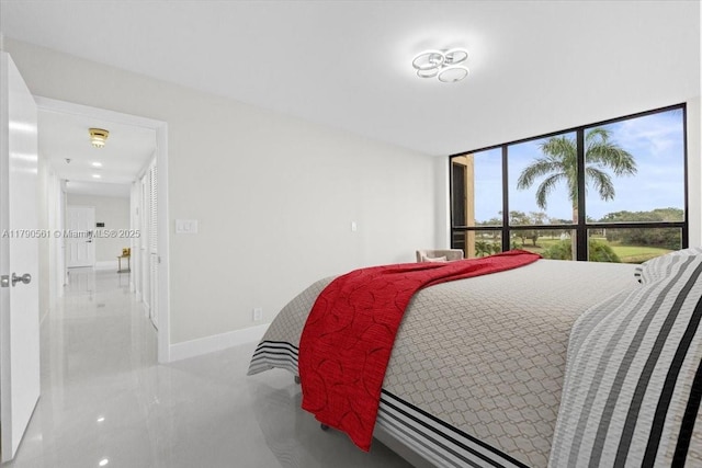 7153 Promenade Dr Unit 302, Boca Raton, FL 33433 - bedroom featuring baseboards