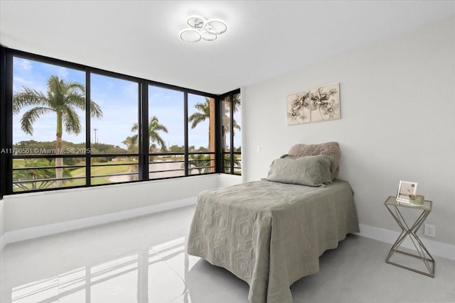 7153 Promenade Dr Unit 302, Boca Raton, FL 33433 - bedroom featuring baseboards and light tile patterned floors