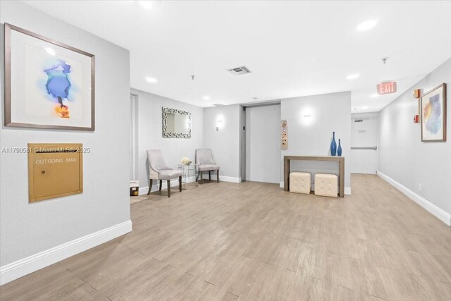 7153 Promenade Dr Unit 302, Boca Raton, FL 33433 - sitting room featuring recessed lighting and light wood-type flooring