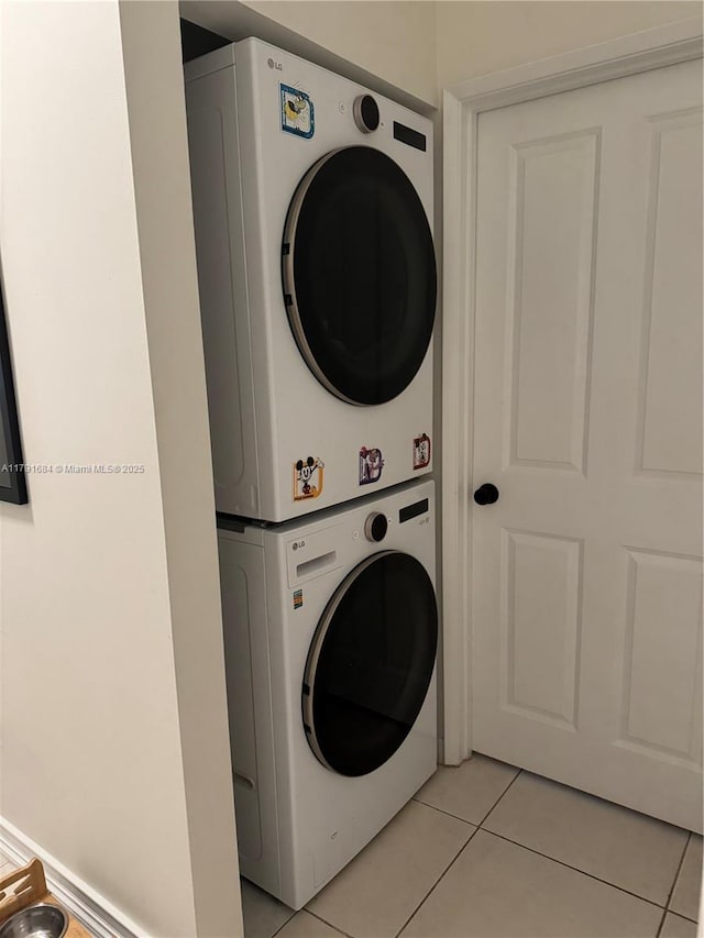 15533 N Miami Lakeway N Unit 101-19, Miami Lakes, FL 33014 - laundry room featuring stacked washer / drying machine, light tile patterned floors, and laundry area