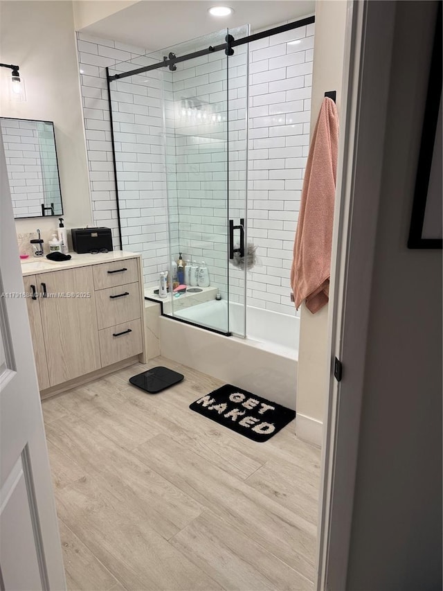 15533 N Miami Lakeway N Unit 101-19, Miami Lakes, FL 33014 - bathroom with enclosed tub / shower combo, wood finished floors, and vanity