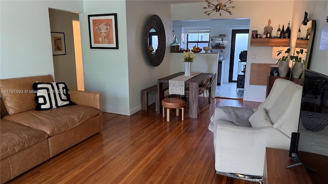 2 NE 44th St, Miami, FL 33137 - living area with an inviting chandelier, wood finished floors, and baseboards