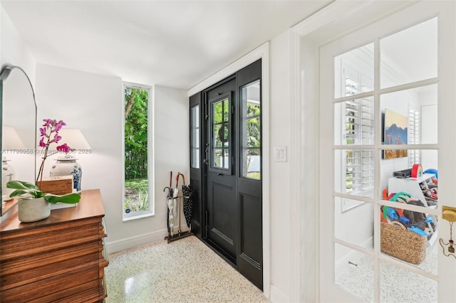 4700 Alhambra Cir, Coral Gables, FL 33146 - foyer entrance with speckled floor and baseboards