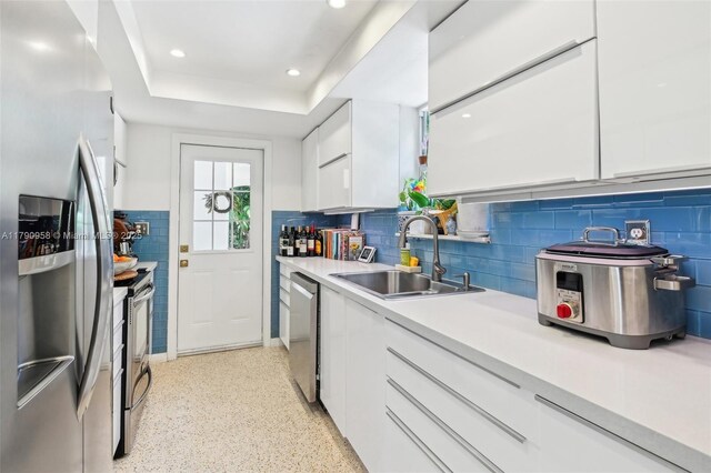 4700 Alhambra Cir, Coral Gables, FL 33146 - kitchen featuring modern cabinets, a sink, stainless steel appliances, light countertops, and white cabinets