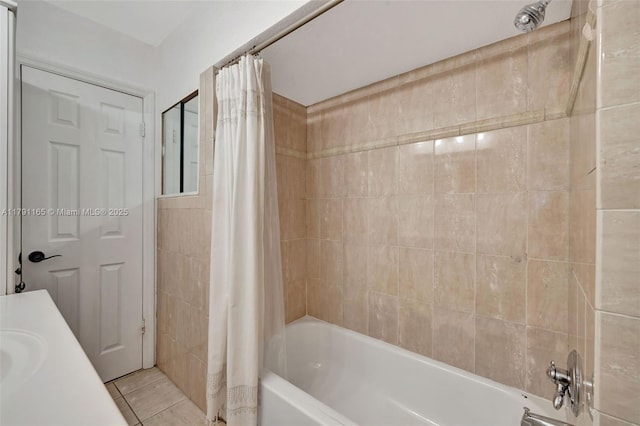 full bathroom featuring tile patterned floors and shower / tub combo with curtain