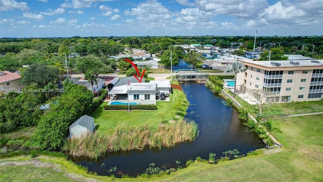 birds eye view of property with a water view