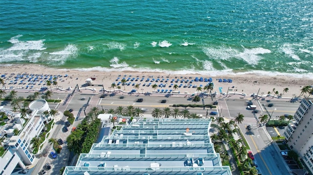 birds eye view of property featuring a view of the beach and a water view