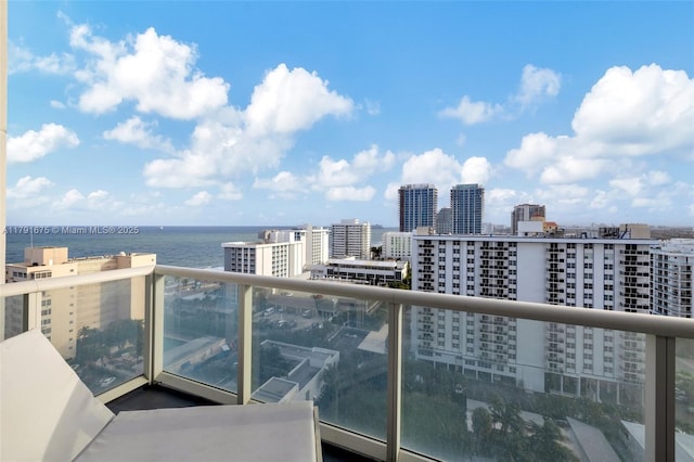 balcony with a view of city and a water view