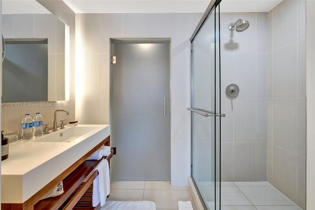 full bathroom featuring vanity, a shower stall, and tile patterned floors