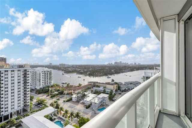 balcony with a view of city and a water view