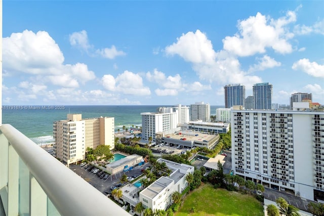 birds eye view of property featuring a view of city and a water view