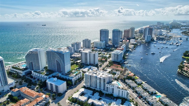 birds eye view of property featuring a view of city and a water view