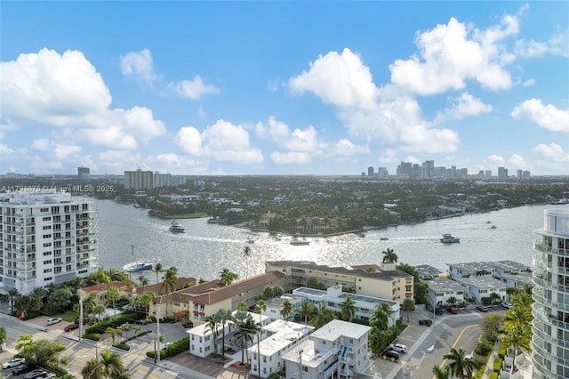 bird's eye view featuring a view of city and a water view