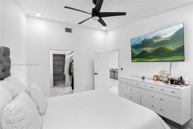 2215 SE 7th Pl, Homestead, FL 33033 - bedroom featuring a textured ceiling, visible vents, ensuite bathroom, recessed lighting, and marble finish floor