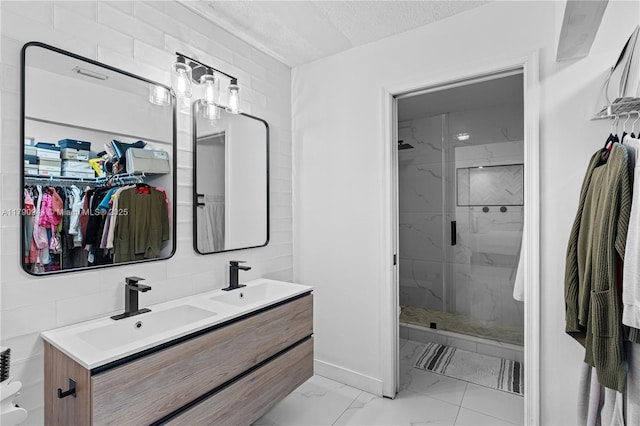 2215 SE 7th Pl, Homestead, FL 33033 - bathroom featuring double vanity, a shower stall, marble finish floor, and a sink