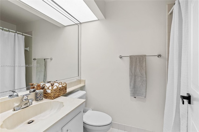 2215 SE 7th Pl, Homestead, FL 33033 - full bath with tile patterned floors, a shower with shower curtain, toilet, vanity, and baseboards