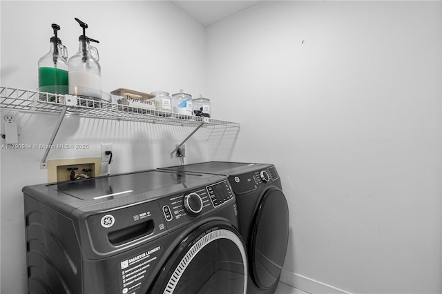 2215 SE 7th Pl, Homestead, FL 33033 - clothes washing area with baseboards, washing machine and clothes dryer, and laundry area
