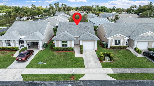 2215 SE 7th Pl, Homestead, FL 33033 - view of front of property featuring a front yard, a residential view, driveway, and an attached garage