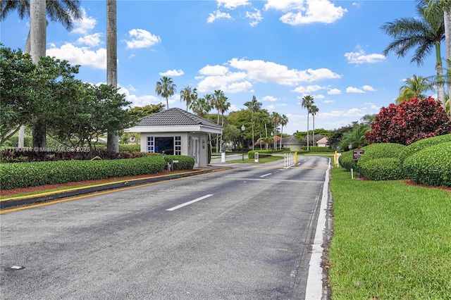2215 SE 7th Pl, Homestead, FL 33033 - view of road featuring curbs, a gated entry, and traffic signs