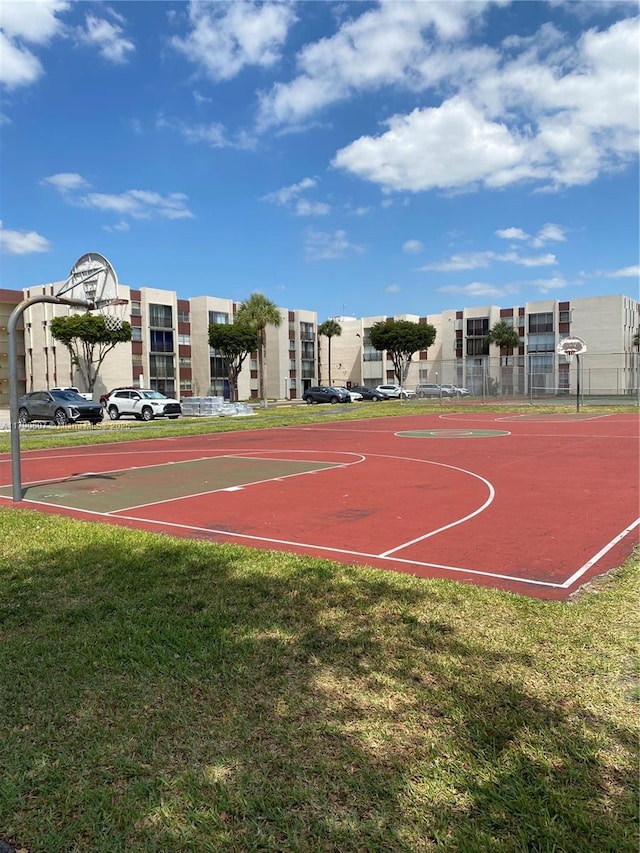 view of sport court with a yard and community basketball court