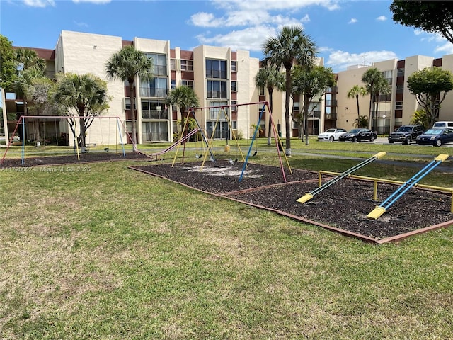 communal playground with a lawn