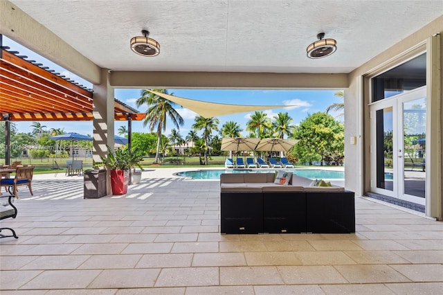 view of patio with an outdoor pool, a pergola, and french doors