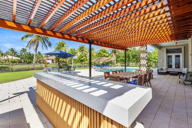 13003 SW 41st St, Davie, FL 33330 - view of patio / terrace featuring a pergola, french doors, and an outdoor pool