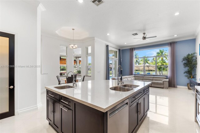 kitchen featuring dishwasher, a sink, open floor plan, and visible vents