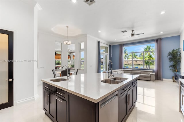 13003 SW 41st St, Davie, FL 33330 - kitchen with a sink, stainless steel dishwasher, open floor plan, ornamental molding, and a center island with sink
