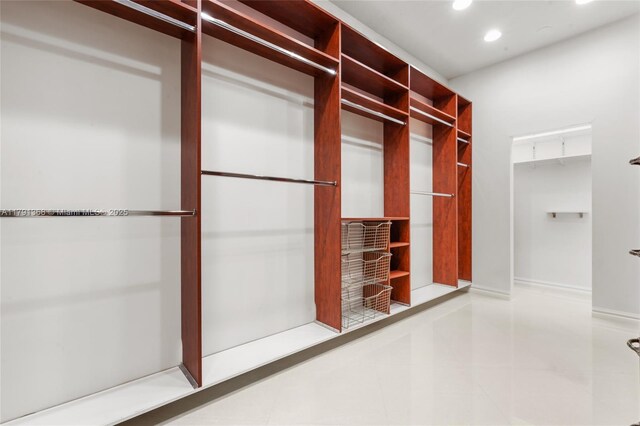 spacious closet featuring tile patterned flooring
