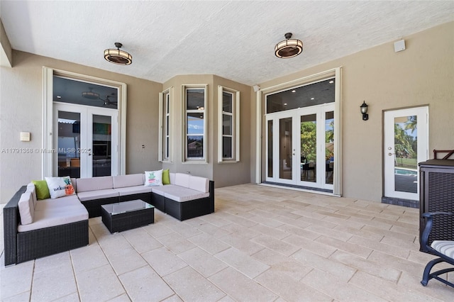 13003 SW 41st St, Davie, FL 33330 - view of patio / terrace featuring french doors and an outdoor living space
