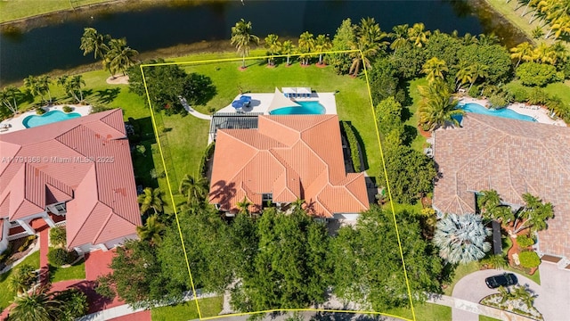 birds eye view of property featuring a water view