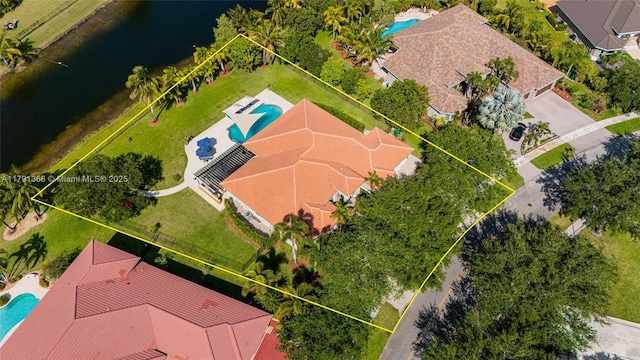 birds eye view of property featuring a water view