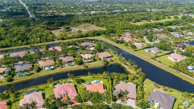 birds eye view of property featuring a residential view and a water view